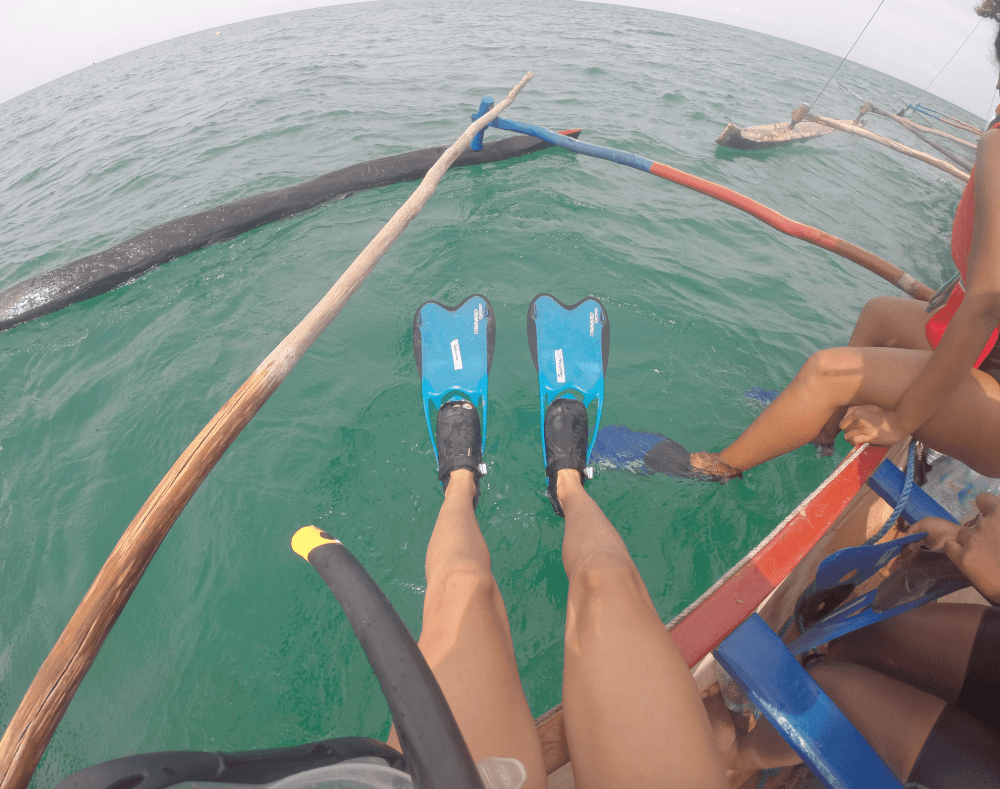Sitting on the Boat with Snorkeling Flippers